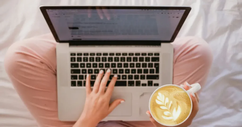 a person reading something on a laptop