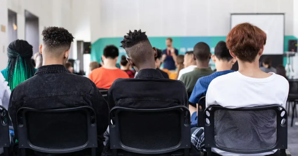 a classroom with a teacher and students